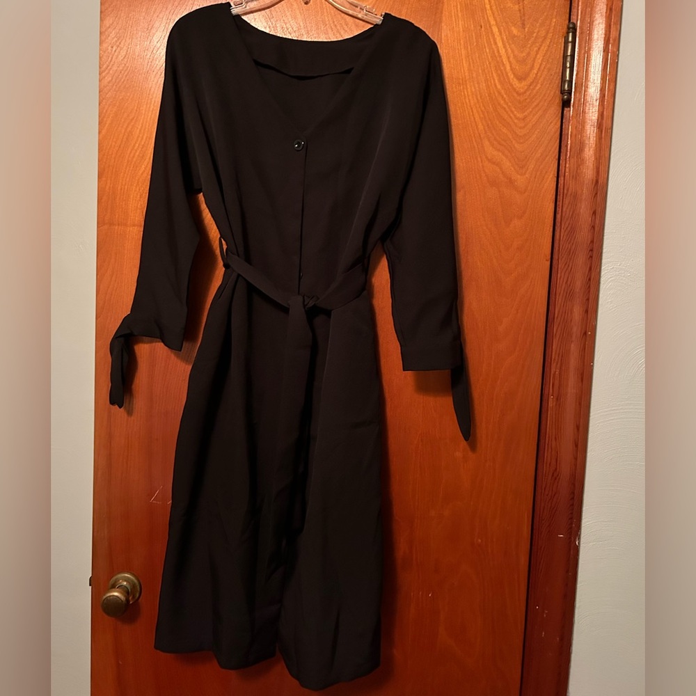Cute never worn black dress. Button down and tie belt and sleeves.